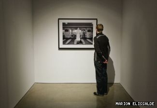 Communication studies professor Tagny Duff in front of <em>Goodbye</em>, a photograph by Suzy Lake in the FOFA Gallerys <em>Proccupations</em>. The show opens Oct. 15 with a panel discussion in the York Amphitheatre at 6 p.m.